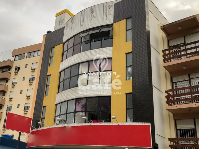 Fachada do prédio com detalhes em amarelo — Apartamento à venda no Residencial Drummond, em Centro, Santa Maria/RS