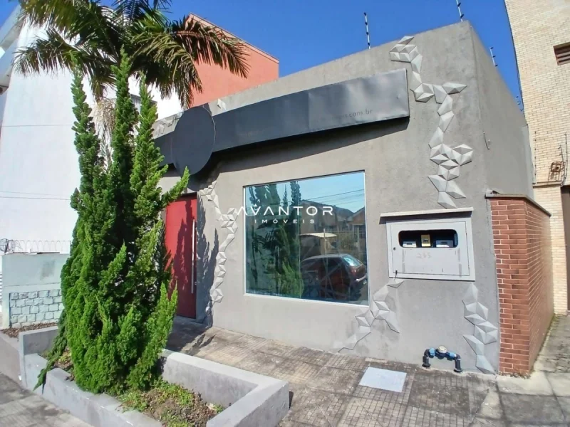 Fachada do imóvel com logotipo — Sala Comercial com 1 sala para alugar em Nossa Senhora de Lourdes, Santa Maria/RS