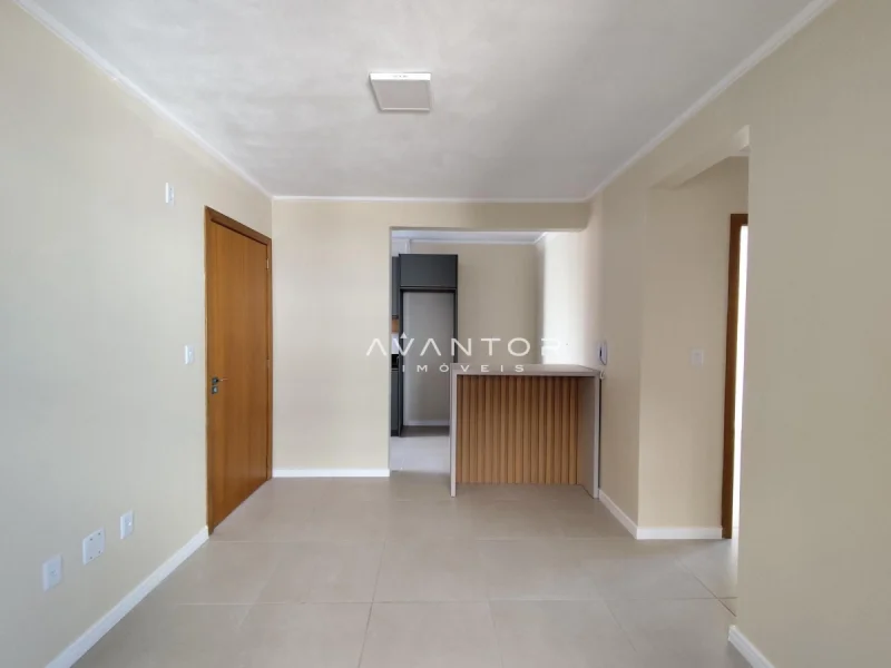 Sala integrada com cozinha e bancada — Apartamento para alugar no Edifício Divano, em Nossa Senhora do Rosário, Santa Maria