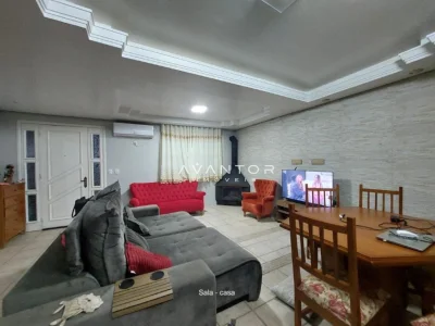 Sala de estar com bancada integrada — Casa com 4 quartos à venda em Nossa Senhora do Perpétuo Socorro, Santa Maria/RS