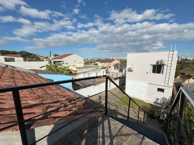 Sacada com vista para vizinhança — Casa com 4 quartos à venda em Nossa Senhora do Perpétuo Socorro, Santa Maria/RS