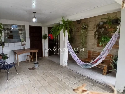 Área de serviço com rede e parede verde — Casa com 3 quartos à venda em Juscelino Kubitschek, Santa Maria/RS