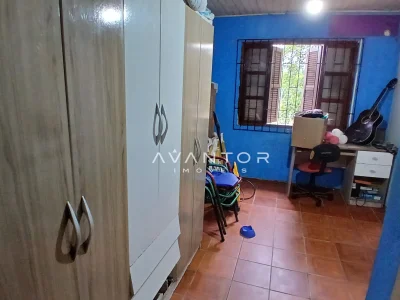 Dormitório com armários planejados — Casa com 3 quartos à venda em Juscelino Kubitschek, Santa Maria/RS