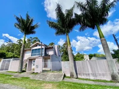 Fachada da casa com palmeiras — Casa com 4 quartos à venda em Dom Antônio Reis, Santa Maria/RS