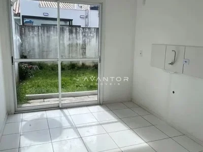 Cozinha com acesso à área externa — Casa com 3 quartos para alugar no Residencial Moradas Clube, em Cerrito, Santa Maria/RS