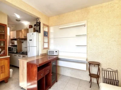 Cozinha integrada com ilha e armários planejados — Prédio Residencial à venda no Residencial Medianeira, Santa Maria