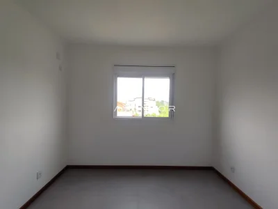 Dormitório com janela e vista externa — Apartamento com 1 quarto para alugar em Camobi, Santa Maria/RS