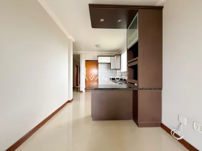 Cozinha integrada à sala com armários planejados — Apartamento com 3 quartos à venda em Dom Antônio Reis, Santa Maria/RS